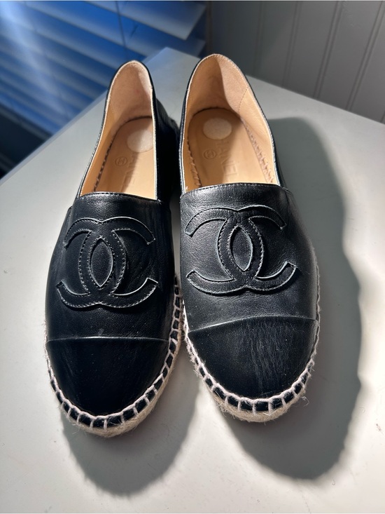 CHANEL Shoes - CHANEL Black Leather Logo Espadrille Slip-Ons